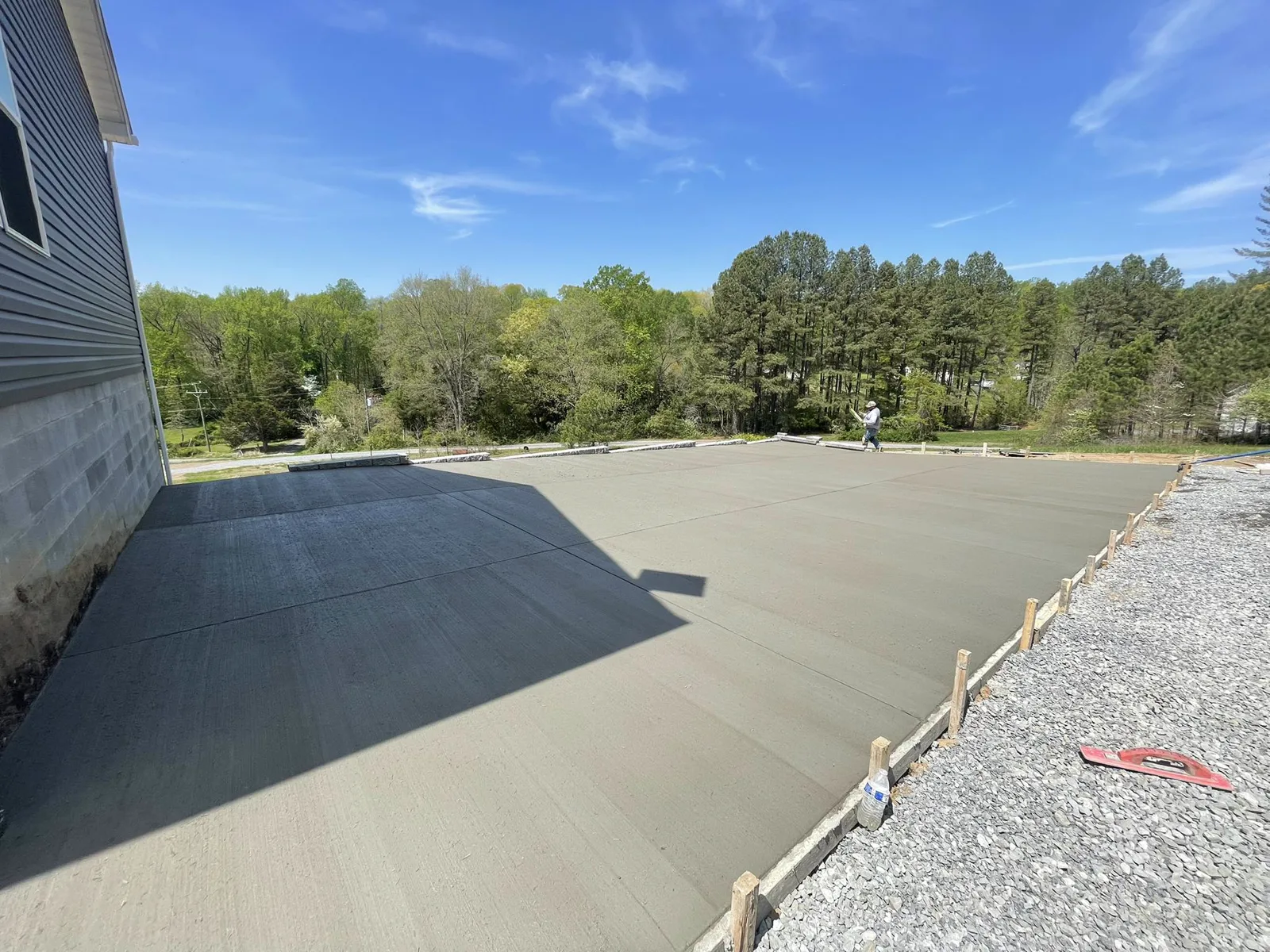 Fresh concrete slab poured and finished inside form boards