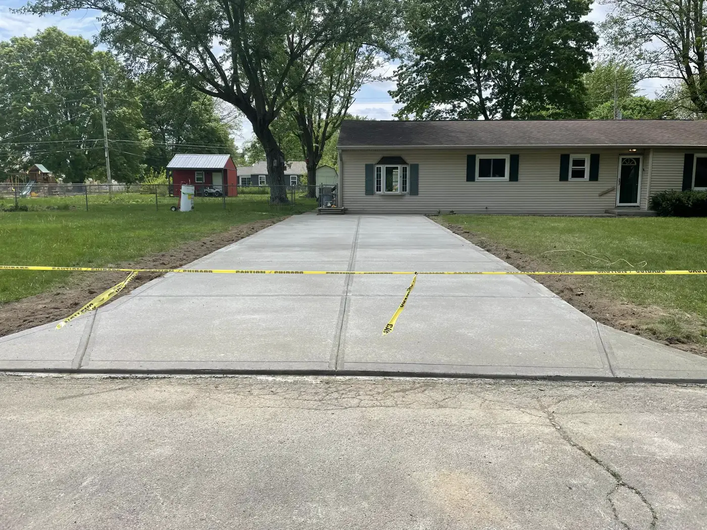 Finished concrete driveway at a single story house